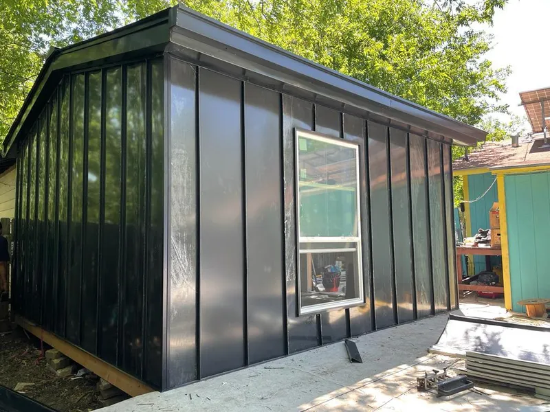 Black standing seam metal wall panels for Roof Inspection in Fort Morgan