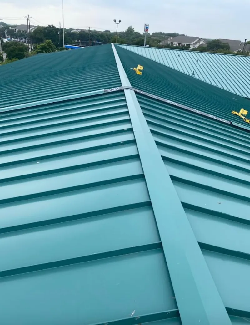 Green commercial metal roof ridge and valley for Metal Roof Repair in Fort Morgan