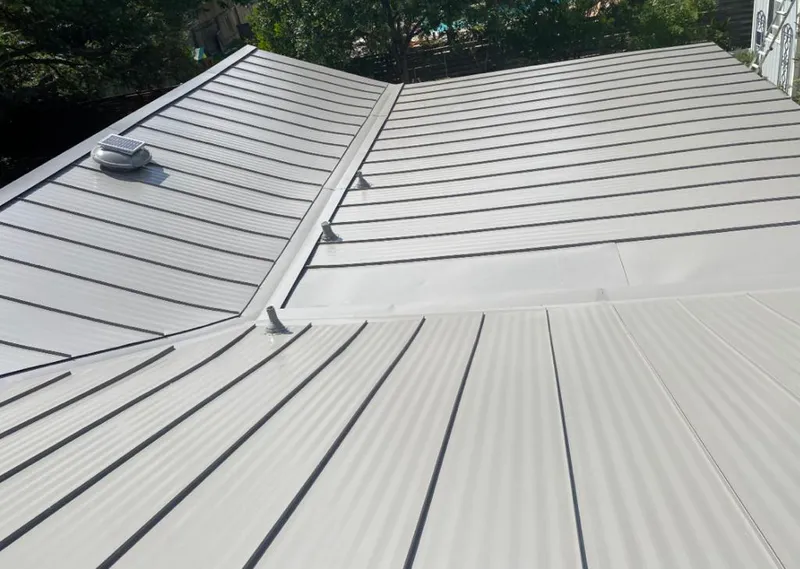 Solar attic fan installed on a metal roof for Roof Ventilation in Fort Morgan
